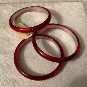 Set of three pink clear/resin bangles